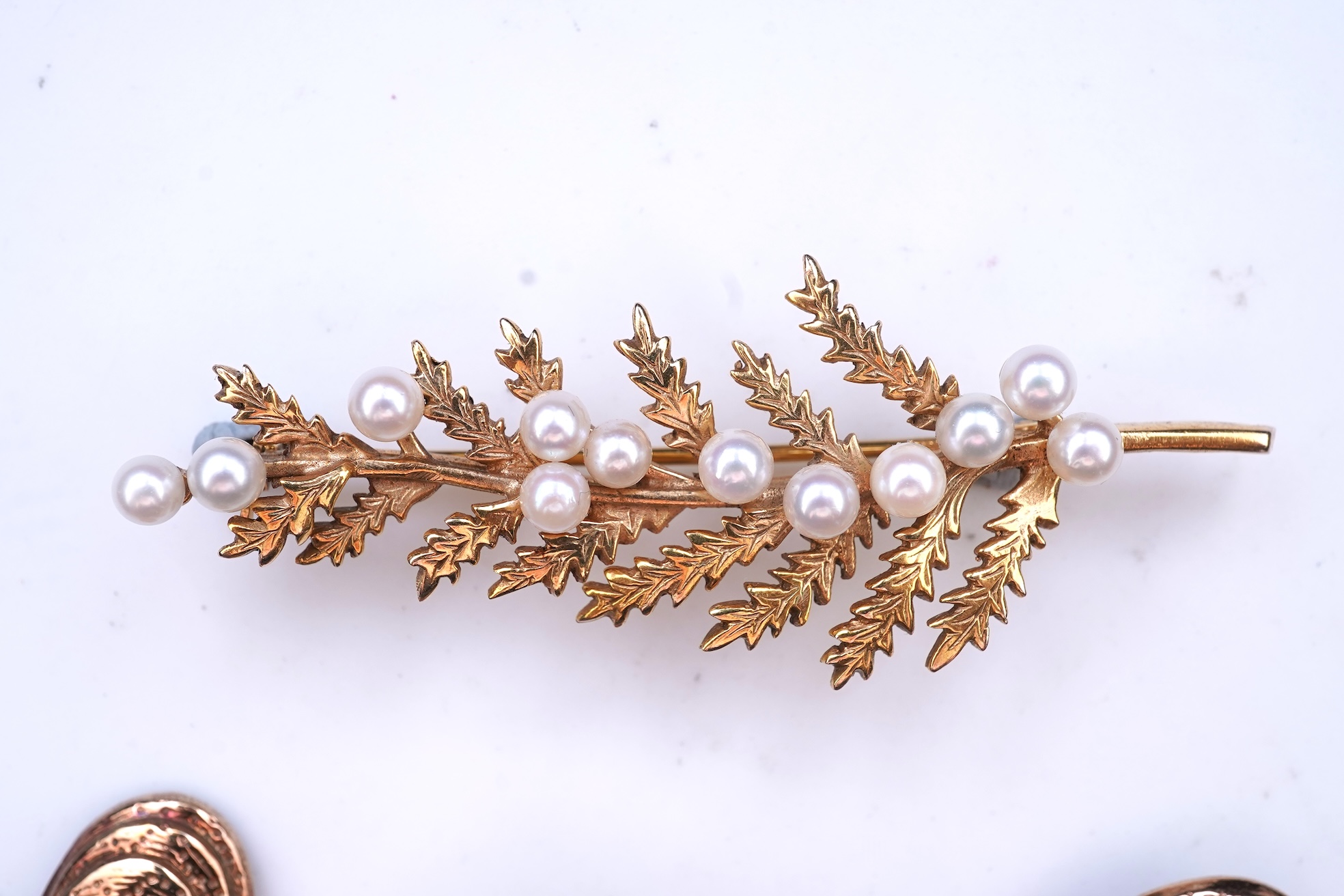 Two cultured pearl brooches